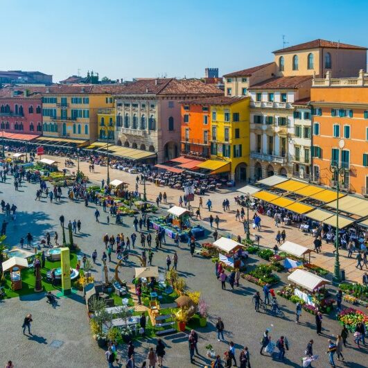 People,Are,Strolling,Among,Flower,Stands,During,Saturday,Market,On